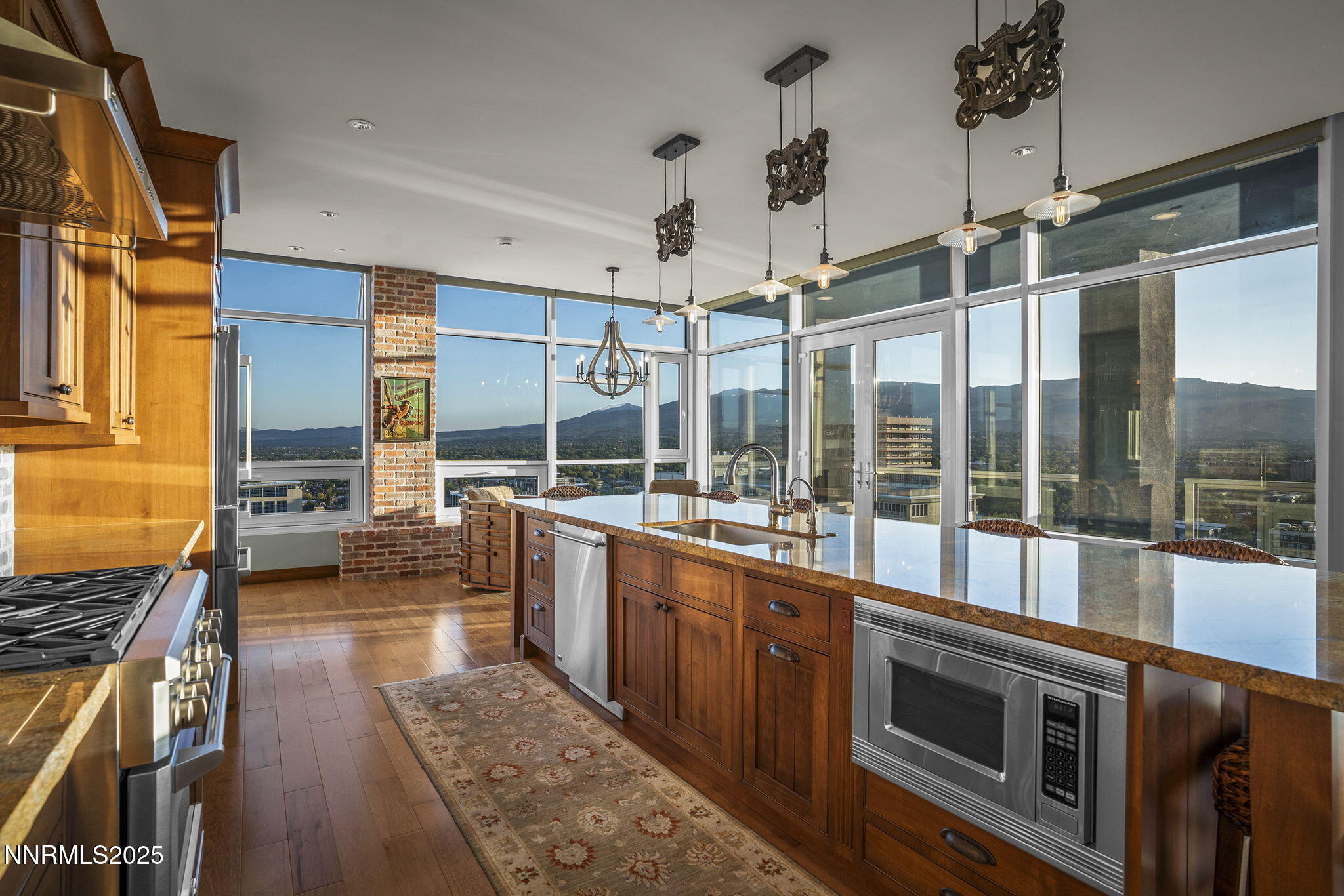255 North Sierra Street, Unit 2303 Reno, NV 89501 - Photo 2 of 58 a open kitchen with stainless steel appliances granite countertop a stove and a wooden floors