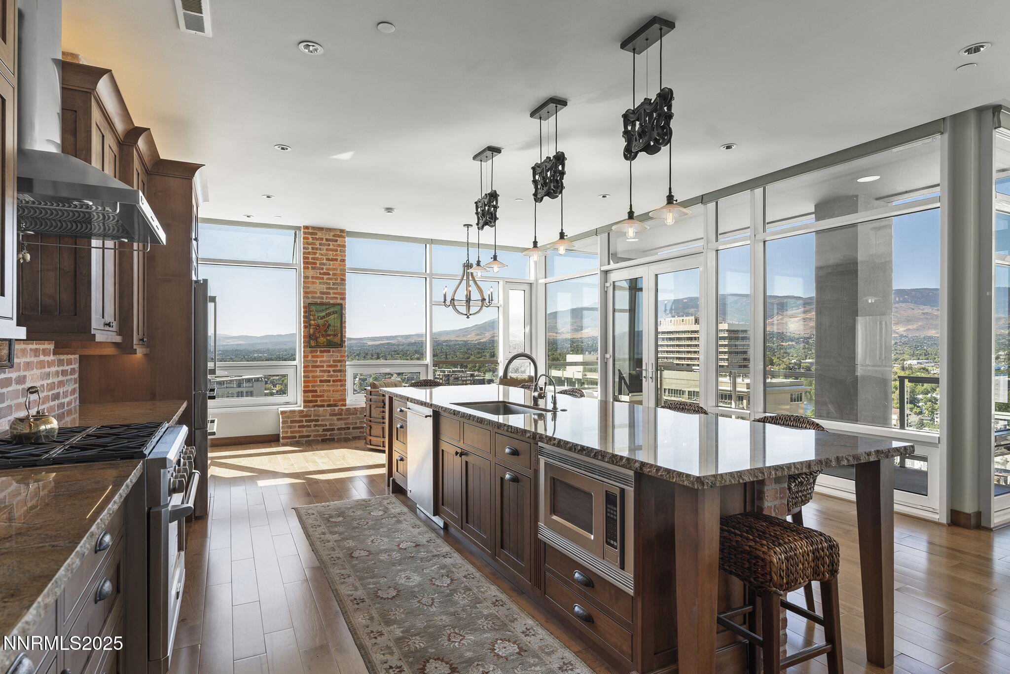 255 North Sierra Street, Unit 2303 Reno, NV 89501 - Photo 24 of 58 a kitchen with stainless steel appliances granite countertop a stove and cabinets