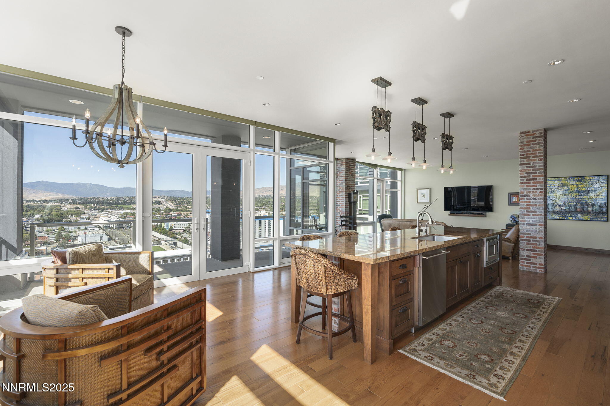 255 North Sierra Street, Unit 2303 Reno, NV 89501 - Photo 26 of 58 a large kitchen with a table and chairs