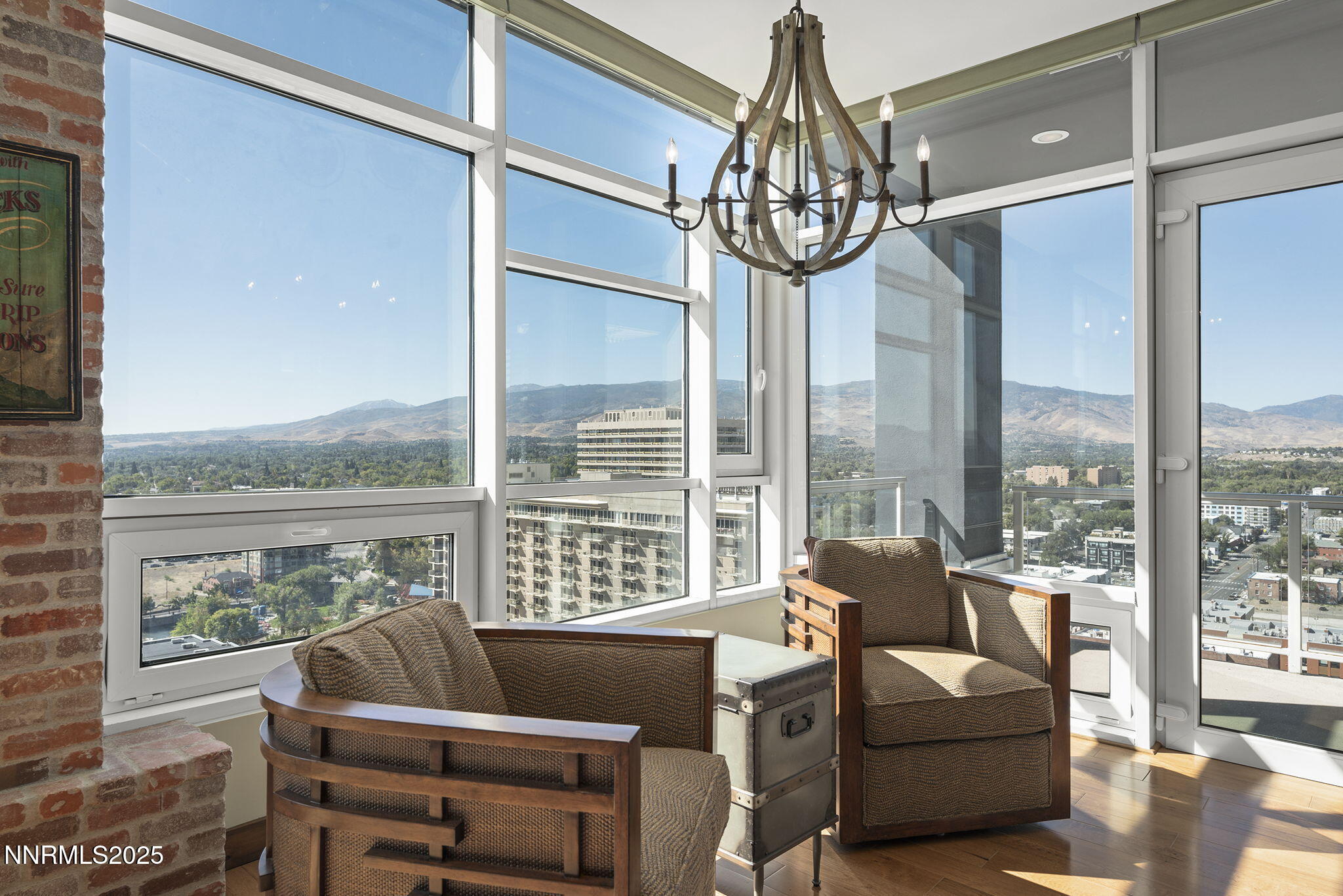 255 North Sierra Street, Unit 2303 Reno, NV 89501 - Photo 27 of 58 a living room with furniture a chandelier and a large window