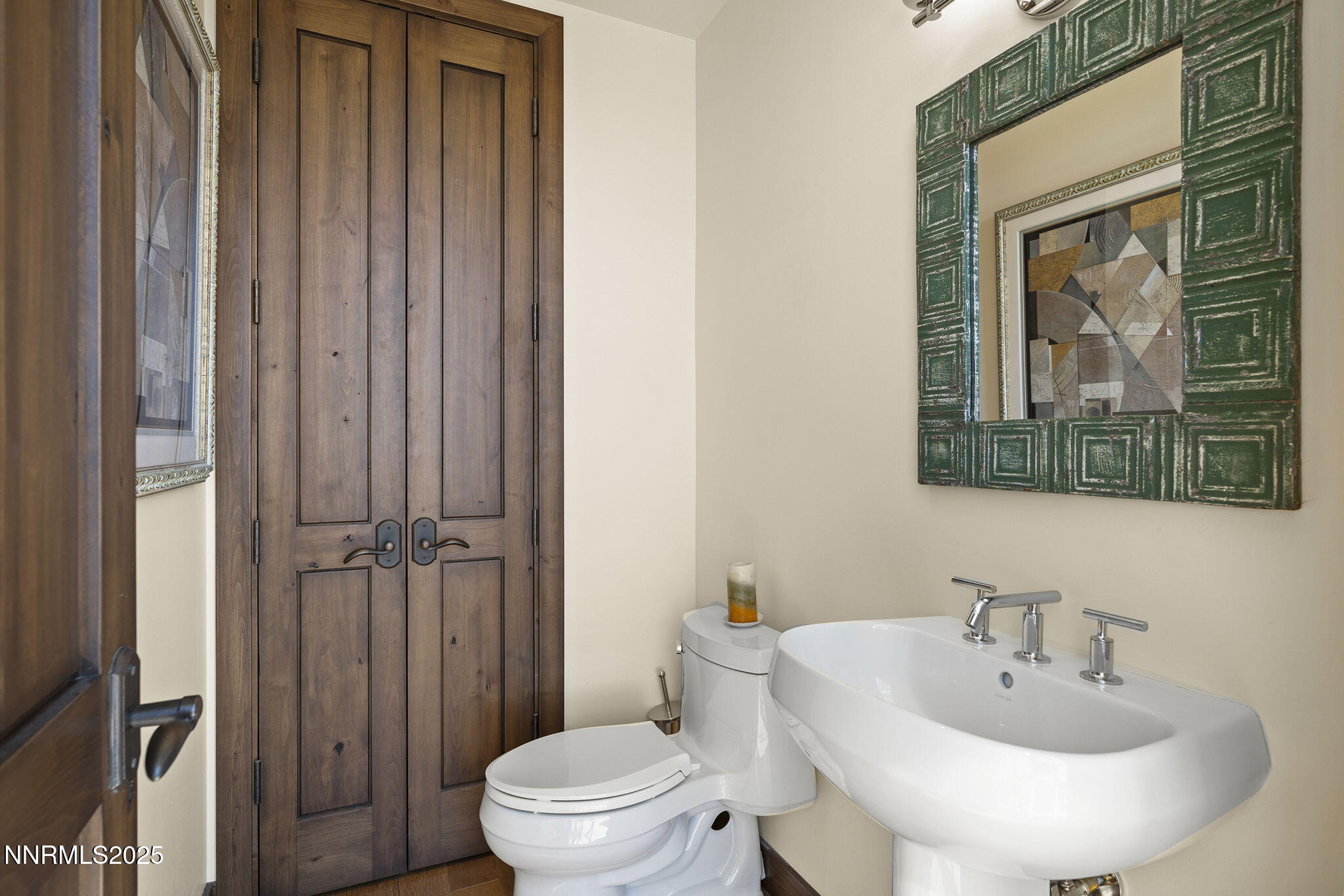 255 North Sierra Street, Unit 2303 Reno, NV 89501 - Photo 29 of 58 a bathroom with a toilet a sink and mirror