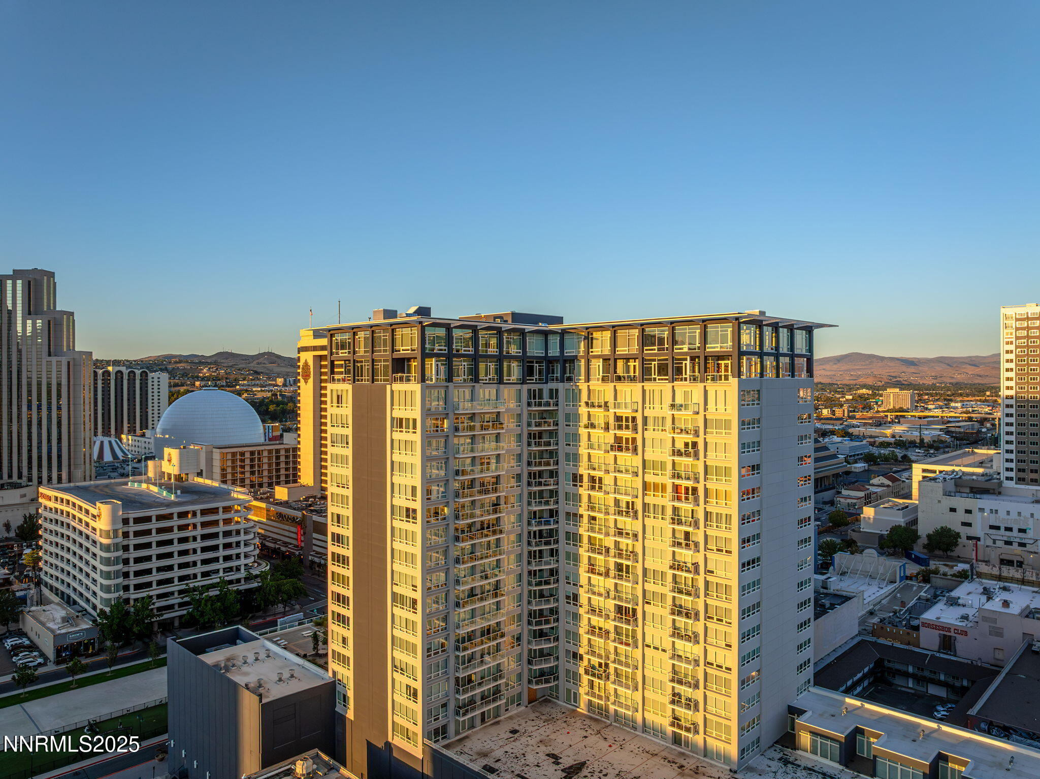 255 North Sierra Street, Unit 2303 Reno, NV 89501 - Photo 31 of 58 a view of a balcony with a couple of cars parked on road