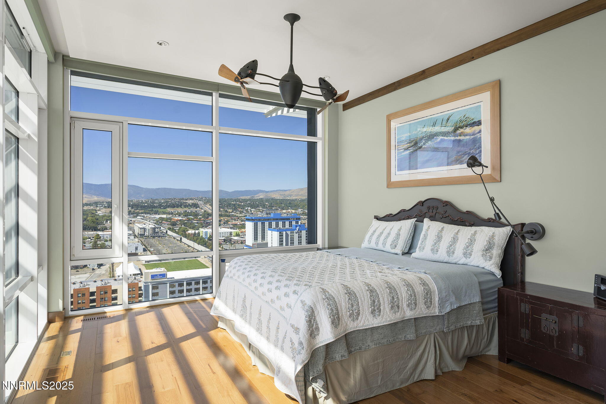 255 North Sierra Street, Unit 2303 Reno, NV 89501 - Photo 33 of 58 a bedroom with a large bed and a large window