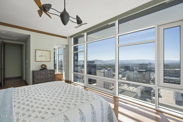 a bathroom with a tub a sink and a window