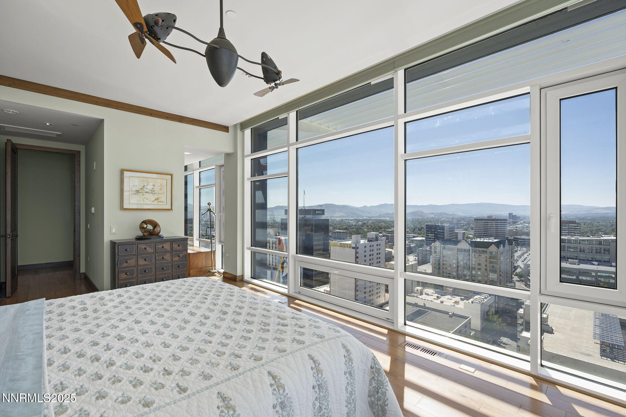 255 North Sierra Street, Unit 2303 Reno, NV 89501 - Photo 34 of 58 a bedroom with a bed and a large window
