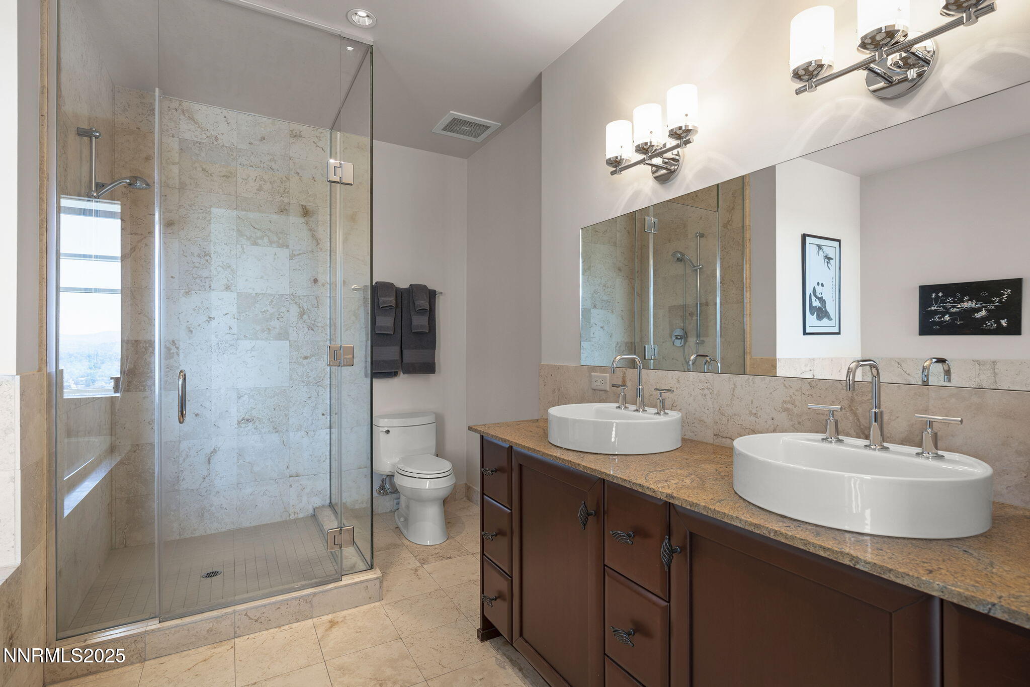 255 North Sierra Street, Unit 2303 Reno, NV 89501 - Photo 36 of 58 a bathroom with a sink double vanity and shower