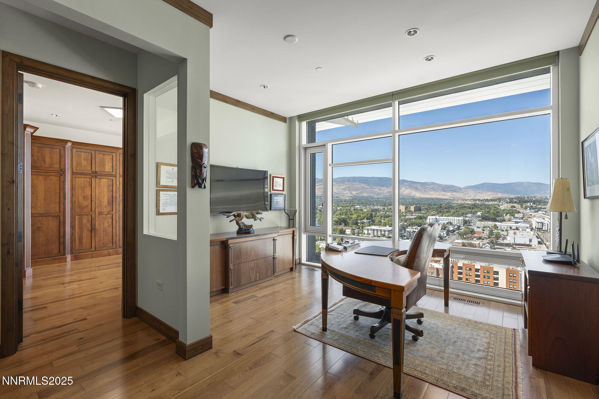 255 North Sierra Street, Unit 2303 Reno, NV 89501 - Photo 40 of 58 a living room with furniture and a floor to ceiling window