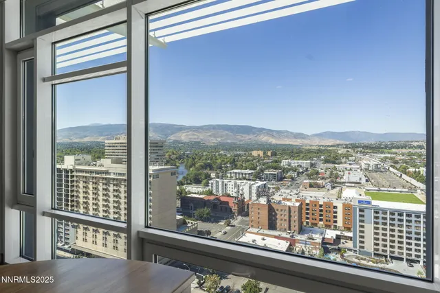 a view of a glass door and a balcony