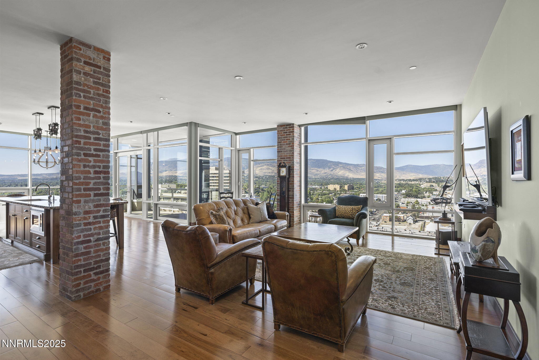 255 North Sierra Street, Unit 2303 Reno, NV 89501 - Photo 10 of 58 a living room with furniture large windows and wooden floor