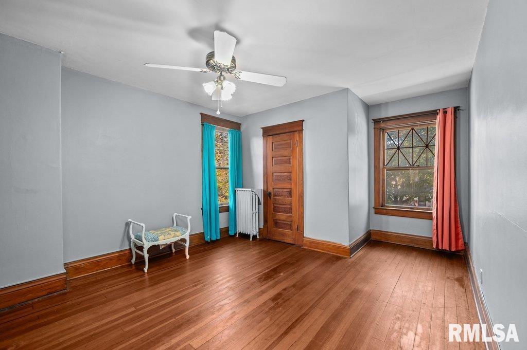 2105 15th Street Moline, IL 61265 - Photo 18 of 29 wooden floor in an empty room with a window