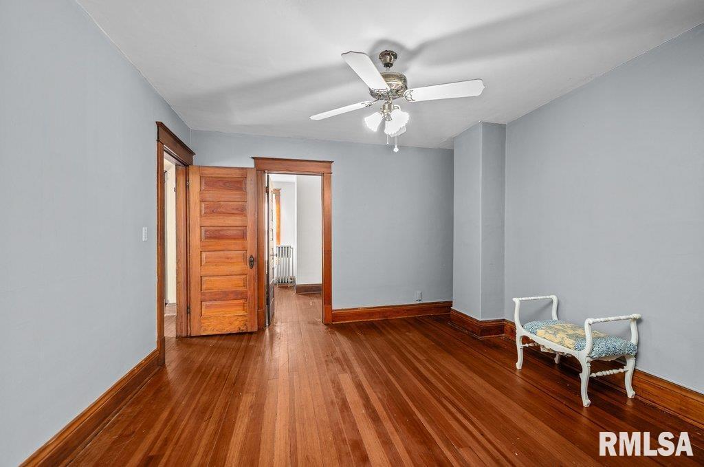 2105 15th Street Moline, IL 61265 - Photo 19 of 29 wooden floor in an empty room with a window