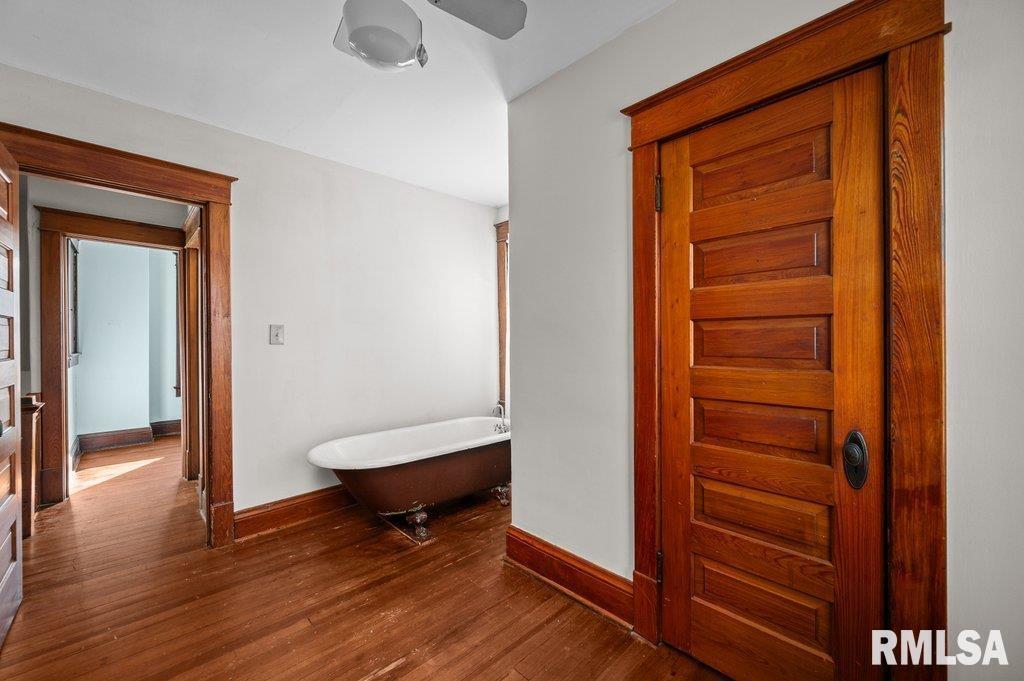 2105 15th Street Moline, IL 61265 - Photo 21 of 29 a living room with a furniture and a walk in closet