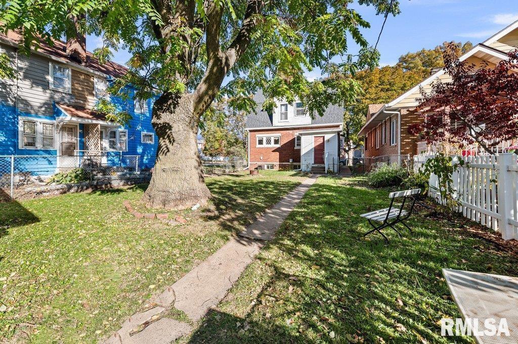 2105 15th Street Moline, IL 61265 - Photo 26 of 29 a backyard of a house with yard and outdoor seating