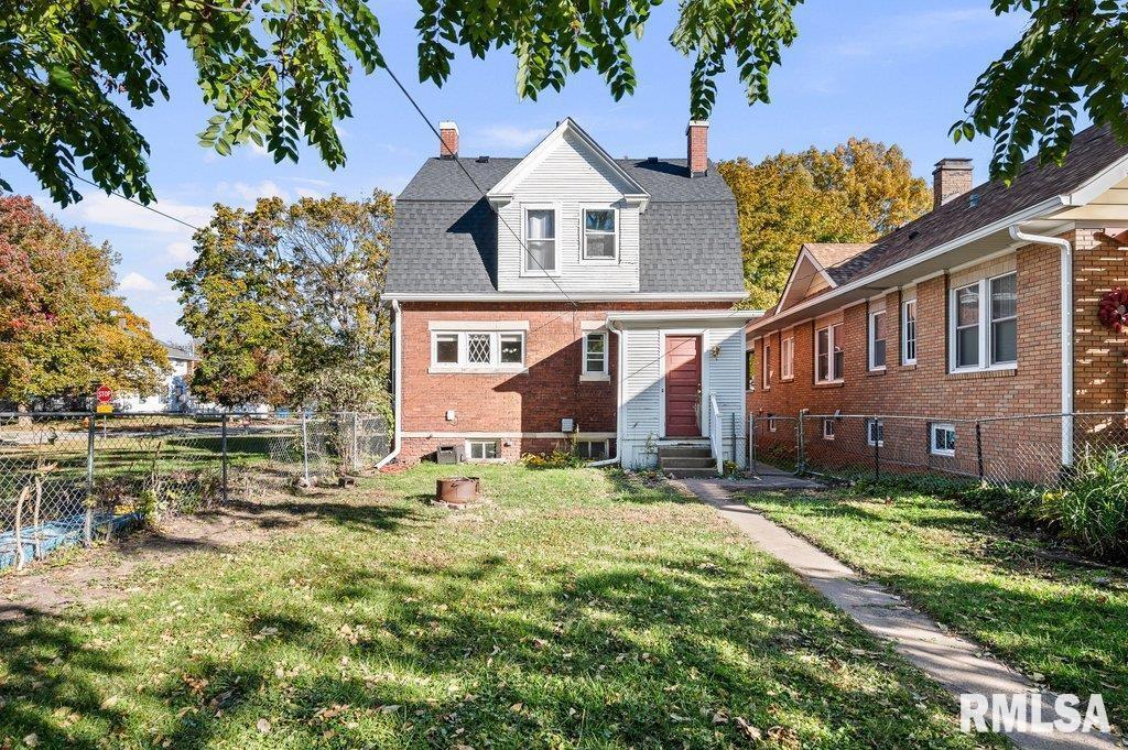 2105 15th Street Moline, IL 61265 - Photo 27 of 29 a view of a big yard next to a building