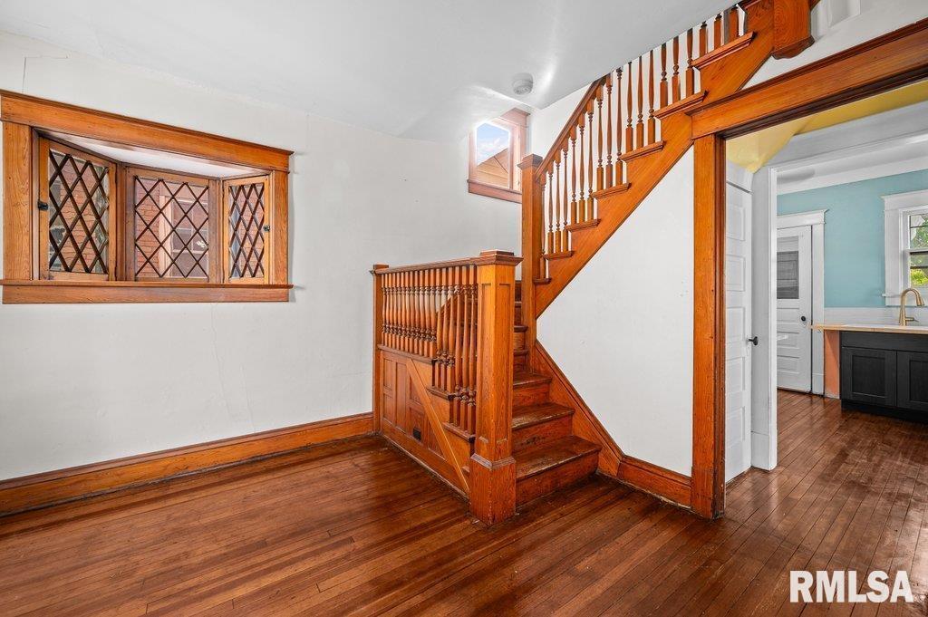 2105 15th Street Moline, IL 61265 - Photo 6 of 29 a view of an entryway with wooden floor and stairs