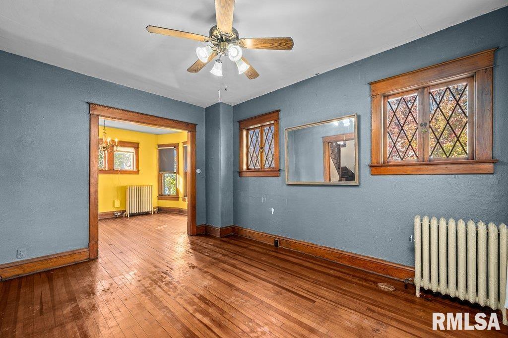 2105 15th Street Moline, IL 61265 - Photo 8 of 29 wooden floor in an empty room with a window