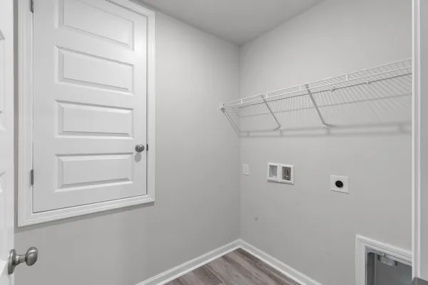 a bedroom with bed and a window