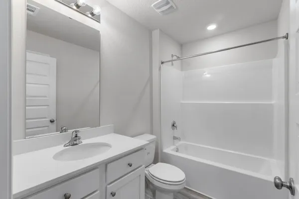 a view of an empty room and a window