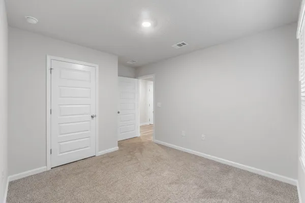 a bathroom with a bathtub shower sink vanity and toilet
