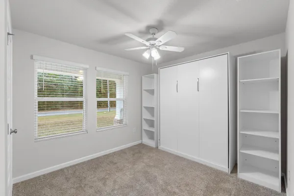 a workspace with furniture and window