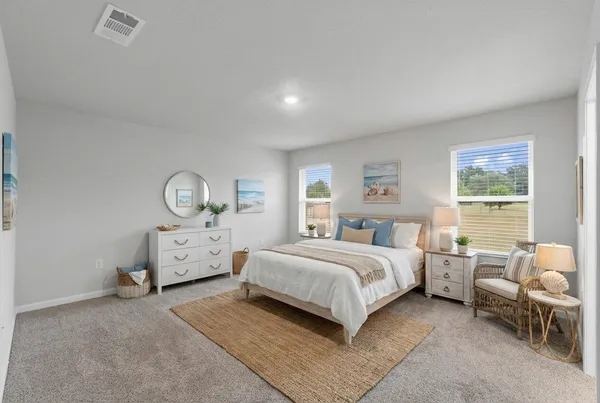 a bed room with a bed and a dresser
