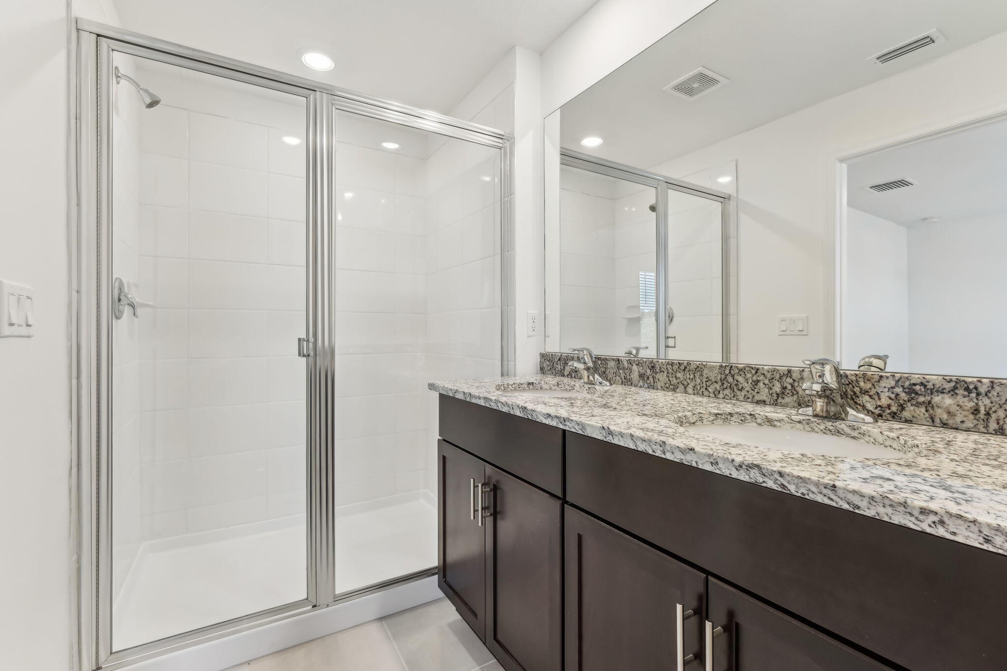 676 Salisbury Circle Fort Pierce, FL 34982 - Photo 19 of 31 a bathroom with a granite countertop sink and a mirror