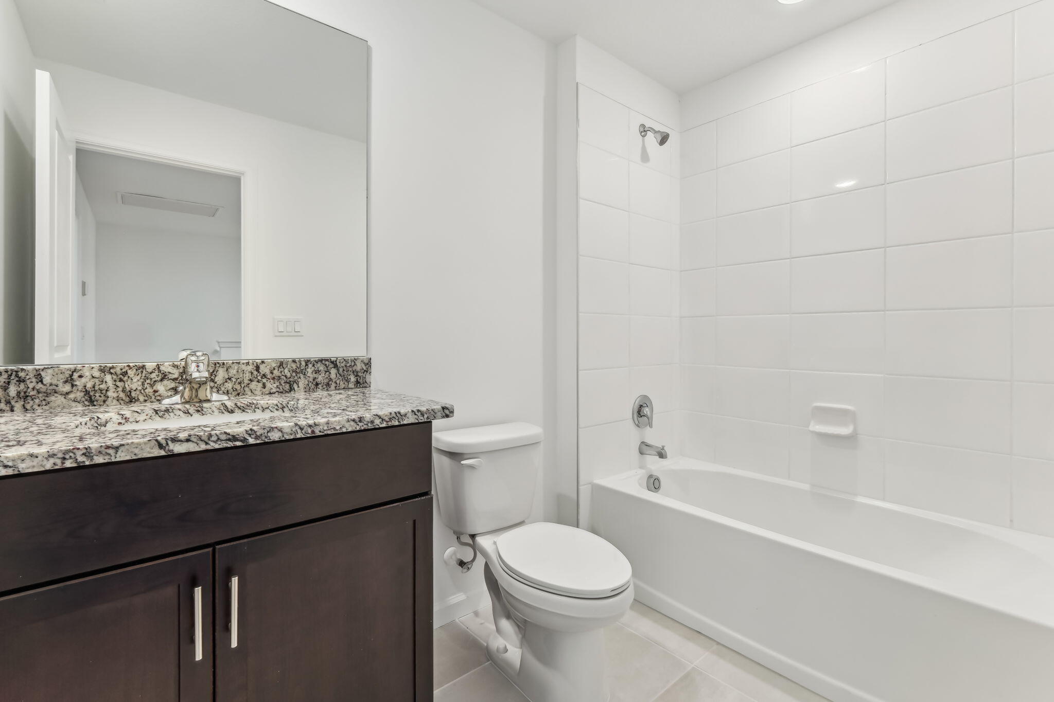 676 Salisbury Circle Fort Pierce, FL 34982 - Photo 20 of 31 a bathroom with a granite countertop sink toilet and shower