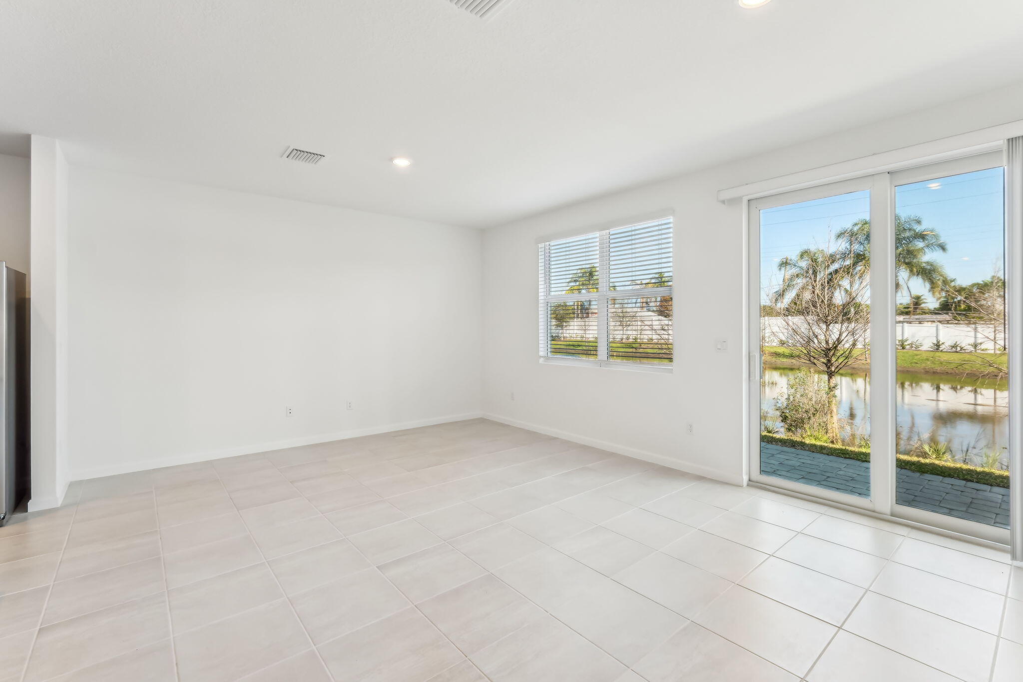 676 Salisbury Circle Fort Pierce, FL 34982 - Photo 6 of 31 a view of an empty room with a window