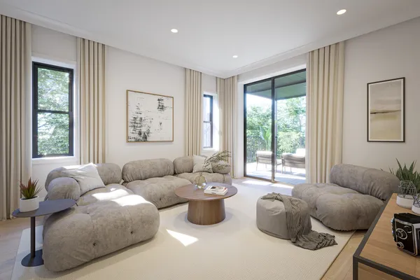 a living room with furniture and a large window