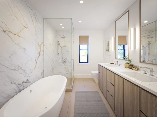 a bathroom with a bathtub shower sink mirror and toilet