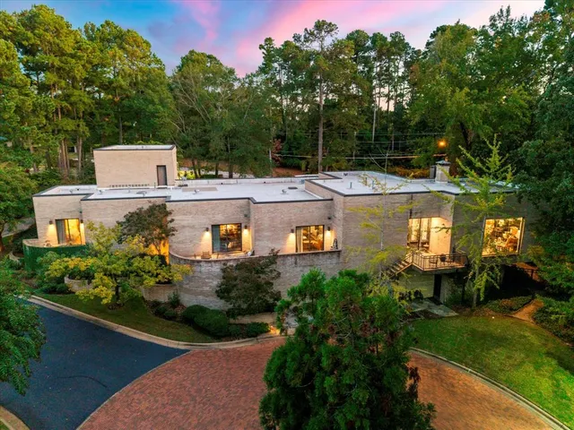 a view of a house with a yard and a pool