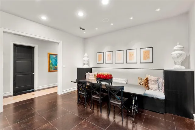 a view of a dining room with furniture and chandelier