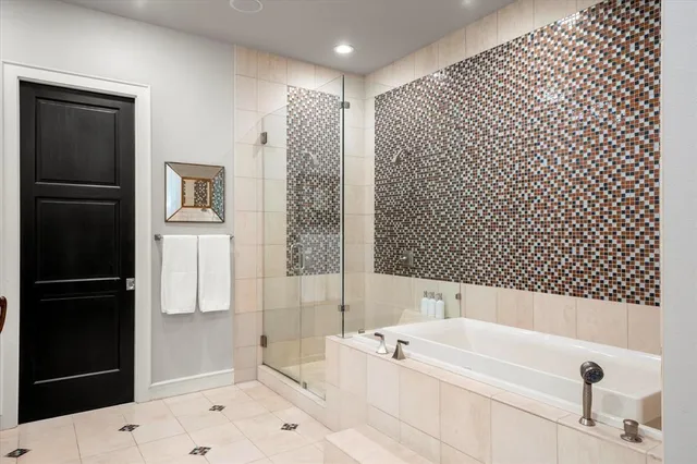 a bathroom with a bathtub and a shower