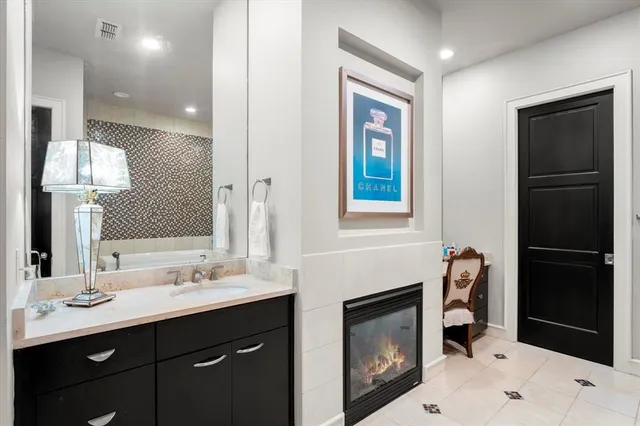 a bathroom with a sink double vanity and a mirror