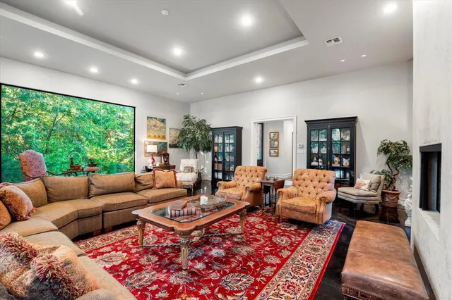 a living room with furniture ceiling fan and a rug