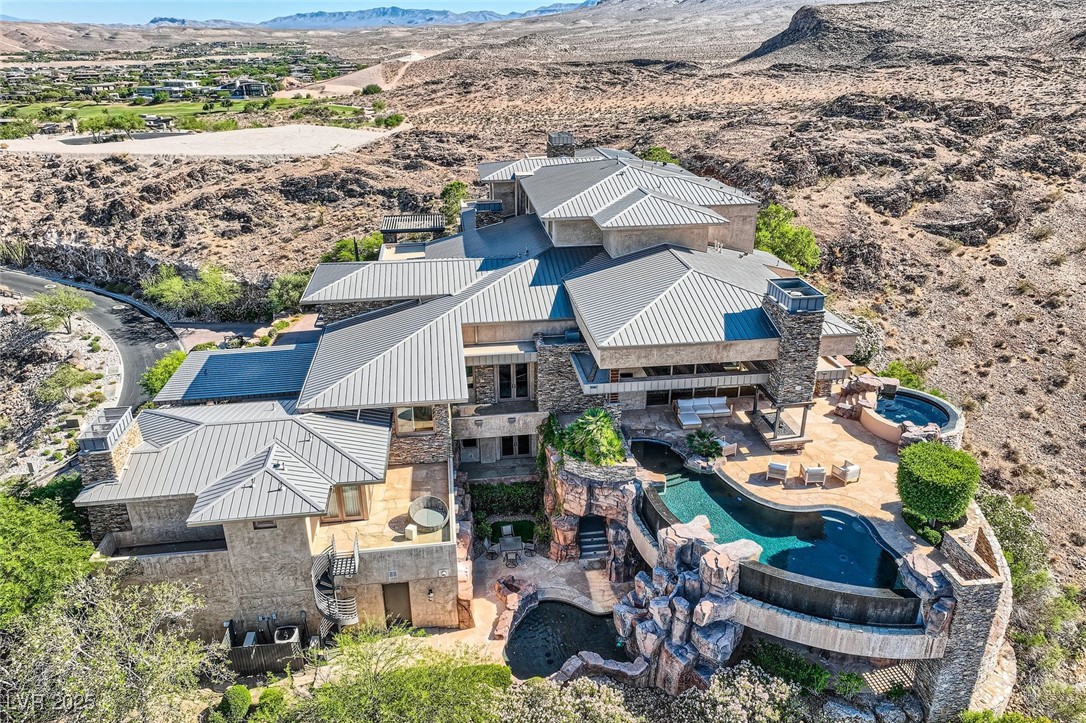 5 Promontory Pointe Lane Las Vegas, NV 89135 - Photo 1 of 64 Aerial view featuring a mountain view