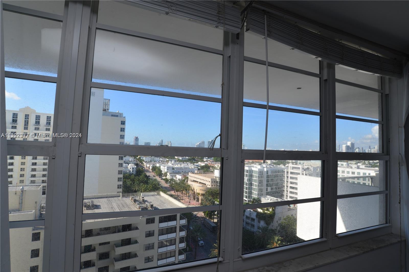 100 Lincoln Road, Unit 1605 Miami Beach, FL 33139 - Photo 11 of 20 a room with a large window