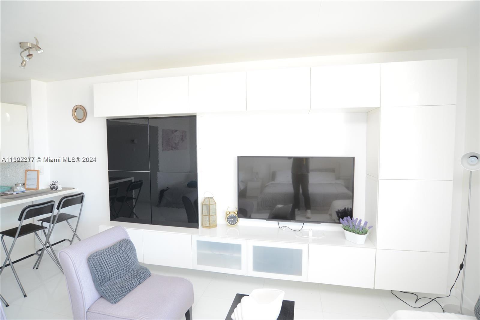 100 Lincoln Road, Unit 1605 Miami Beach, FL 33139 - Photo 5 of 20 a living room with furniture