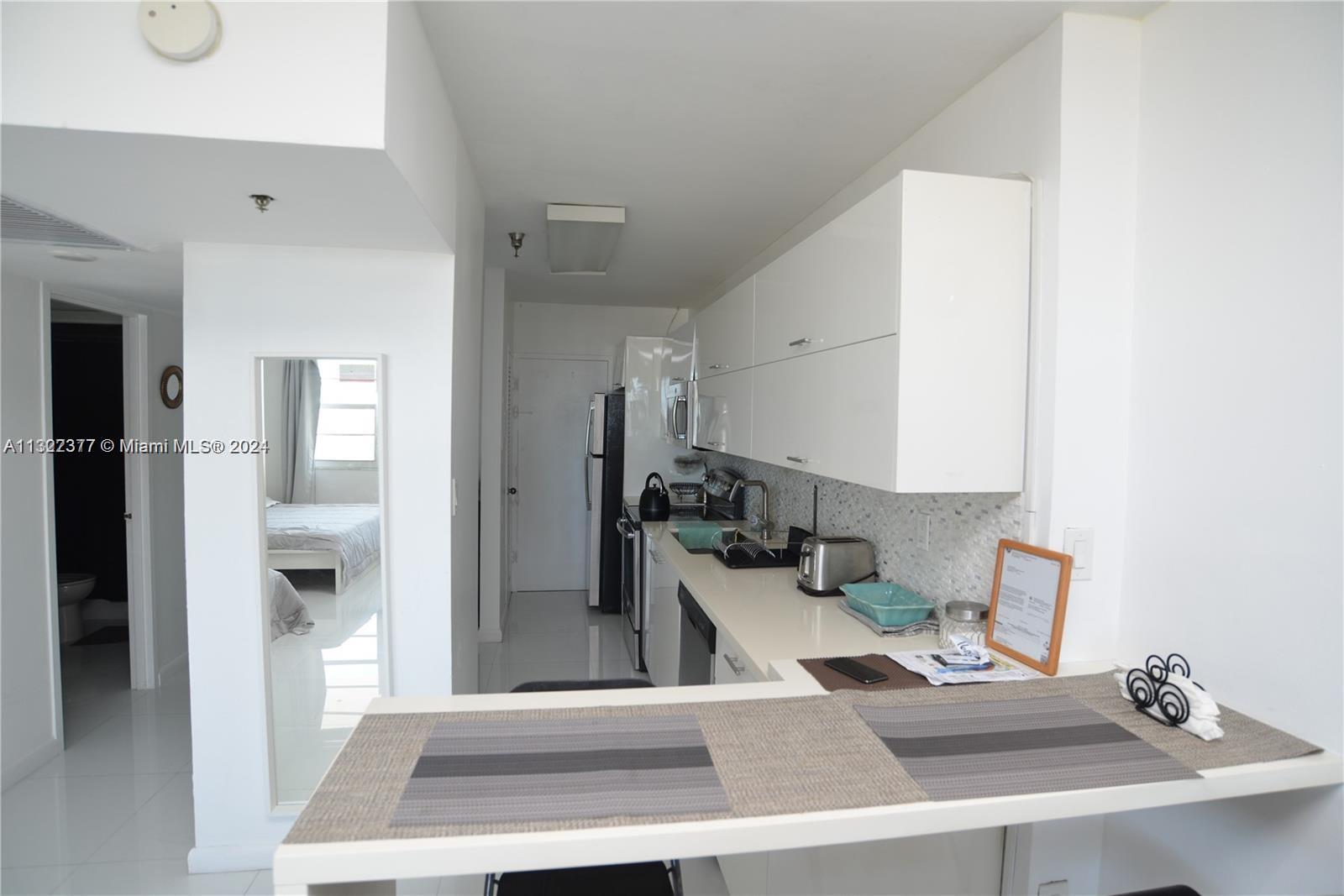 100 Lincoln Road, Unit 1605 Miami Beach, FL 33139 - Photo 8 of 20 a room with a couch and a view of living room