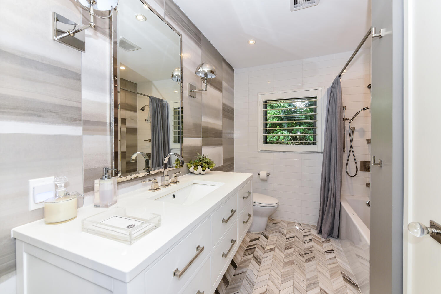 880 Hickory Terrace Boca Raton, FL 33486 - Photo 23 of 38 a bathroom with a sink toilet and shower