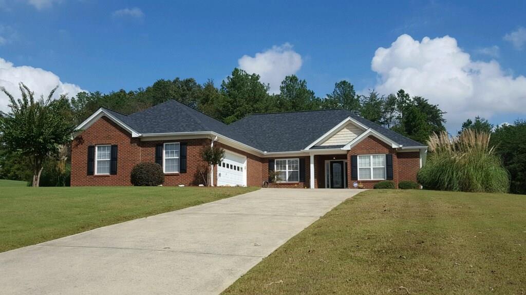 68 Stringer Road Rockmart, GA 30153 - Photo 1 of 1 a front view of a house with a garden and trees