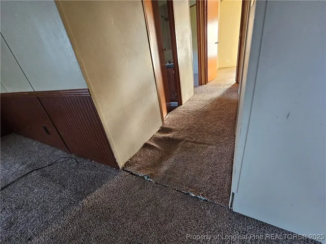 a view of staircase and door