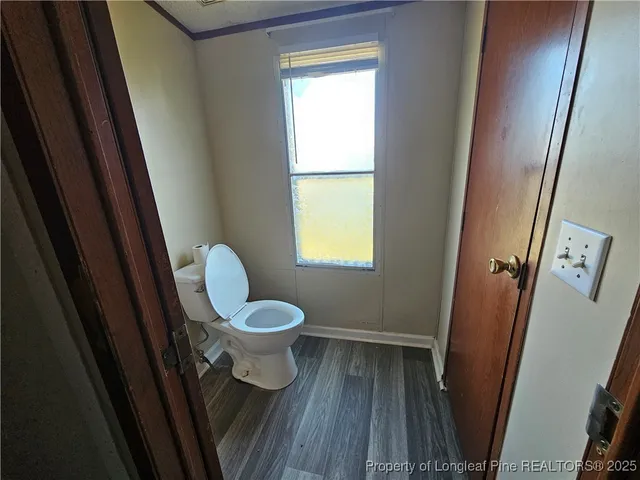 a bathroom with a toilet and a sink