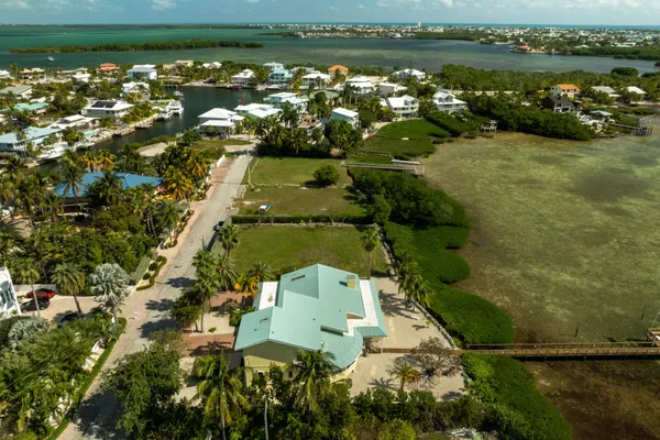 an aerial view of a houses with outdoor space