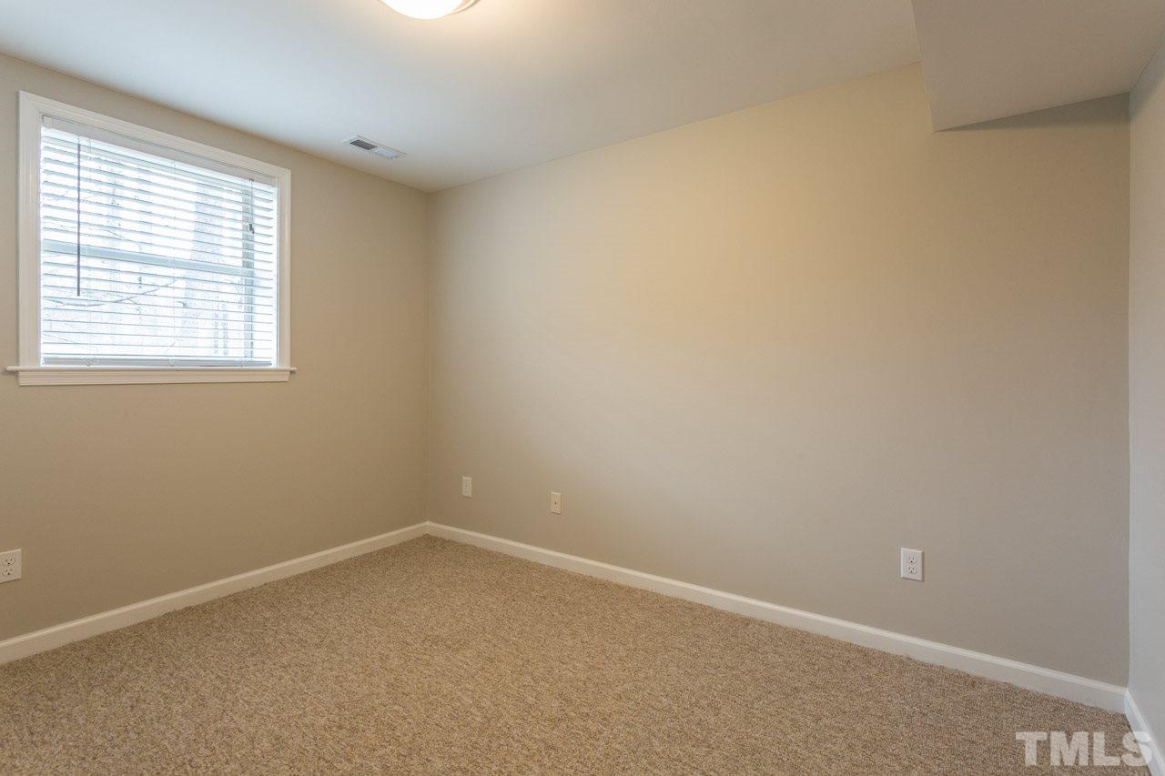 1232 Nikole Court Raleigh, NC 27612 - Photo 22 of 30 an empty room with a window