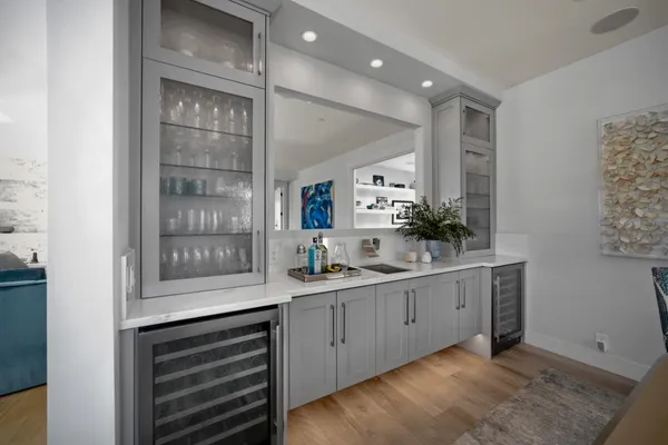 a kitchen with sink and cabinets