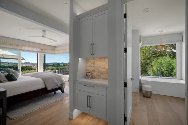 a bedroom with furniture and a window