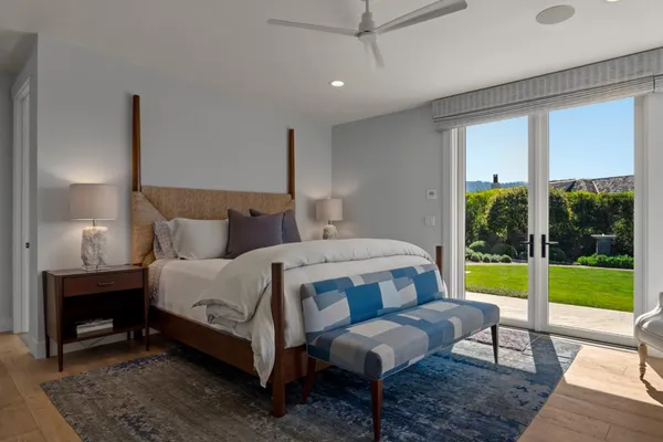 a bedroom with a bed and a table