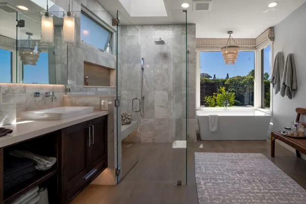 a bathroom with a sink a toilet and a shower