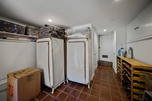 a view of a storage & utility room with two washing machine